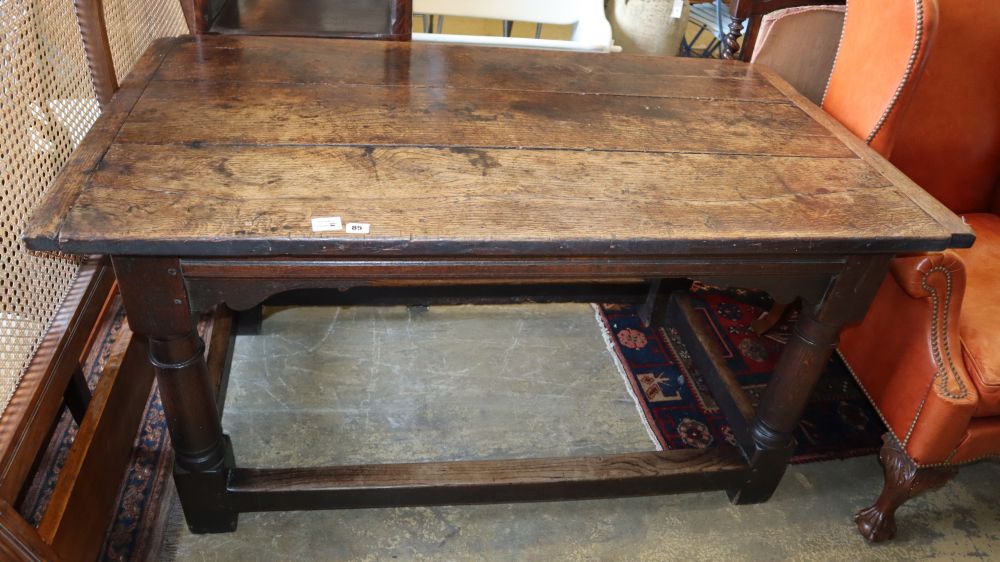 A small late 17th century and later oak refectory table, on gun barrel supports with all round stretchers, W.147cm, D.80cm, H.77cm